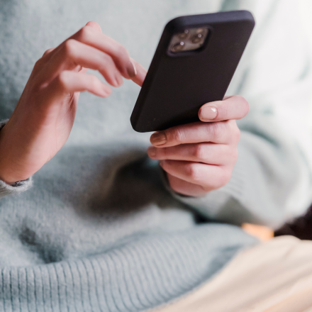 woman looking for unplanned pregnancy support on her phone